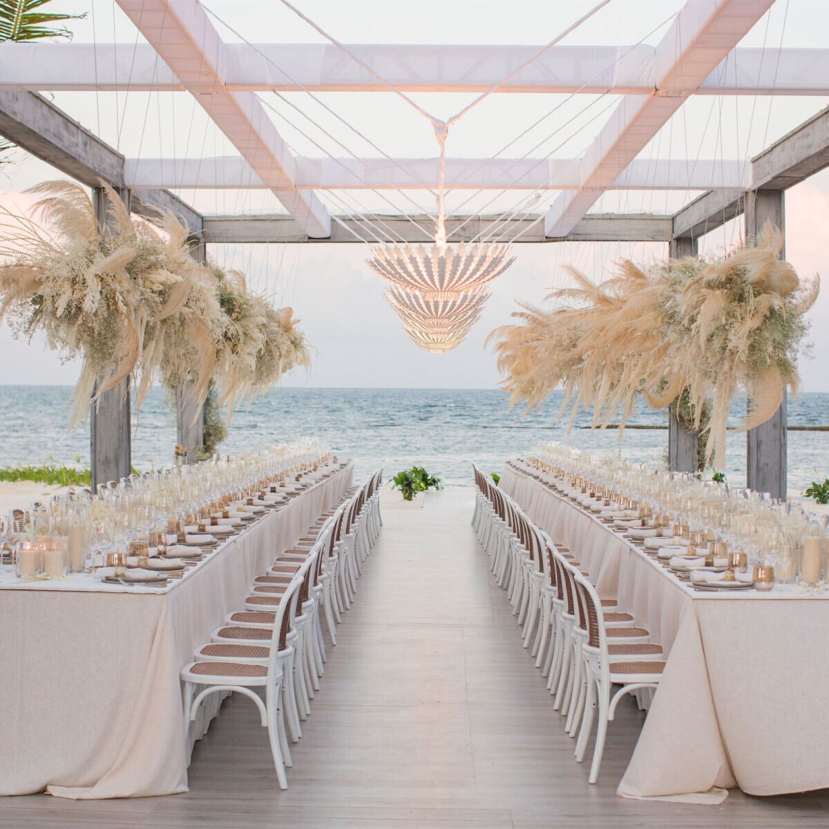 Wedding Venue: Rosewood Mayakoba, wedding reception tables overlooking the ocean