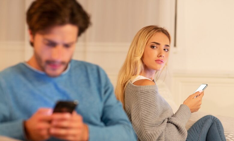 wife watching husband texting on phone suspecting 2022 10 07 02 36 41 utc