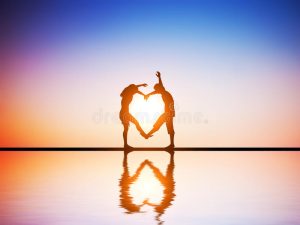 happy couple love making heart shape their bodies sunset water reflection 39162188 002