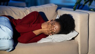 depressed african woman lying on sofa crying alone 2022 11 15 04 20 51 utc